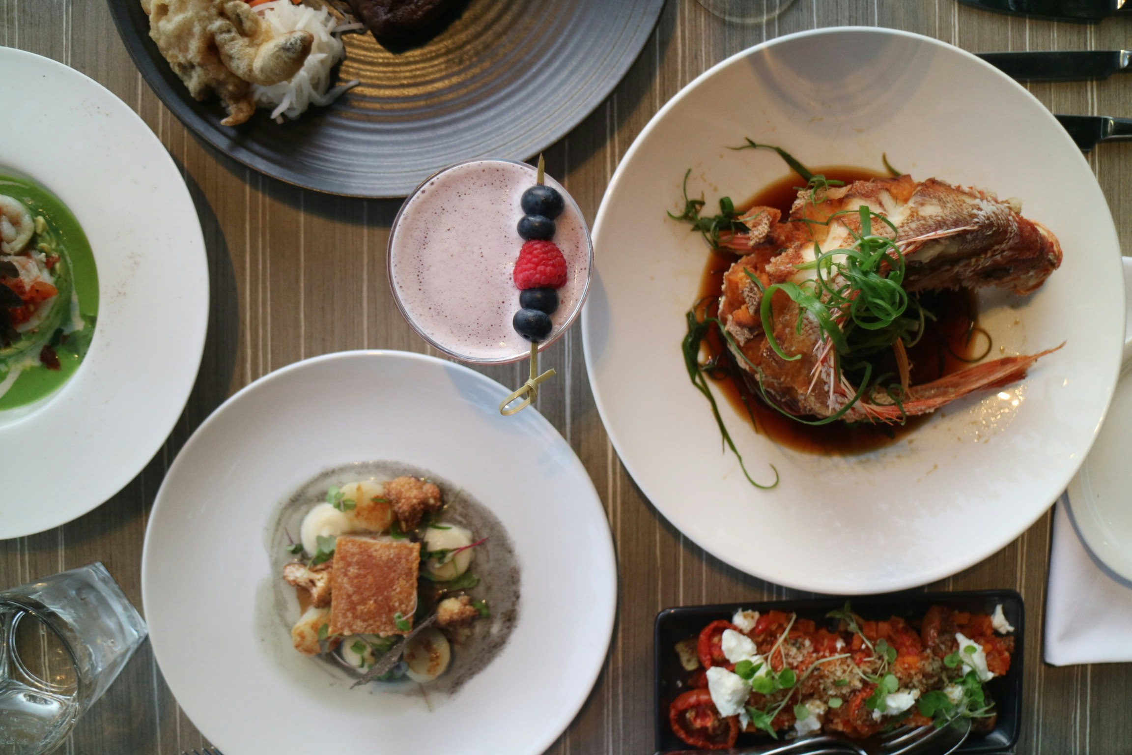 Crispy Local Baby Barramundi and pork belly dishes at Char restaurant