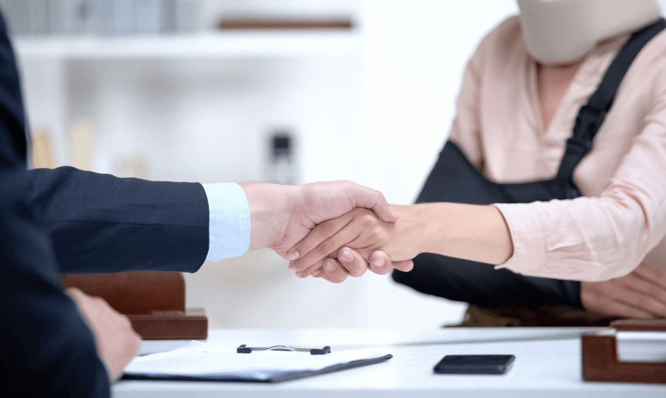 Lawyer shaking a clients hand