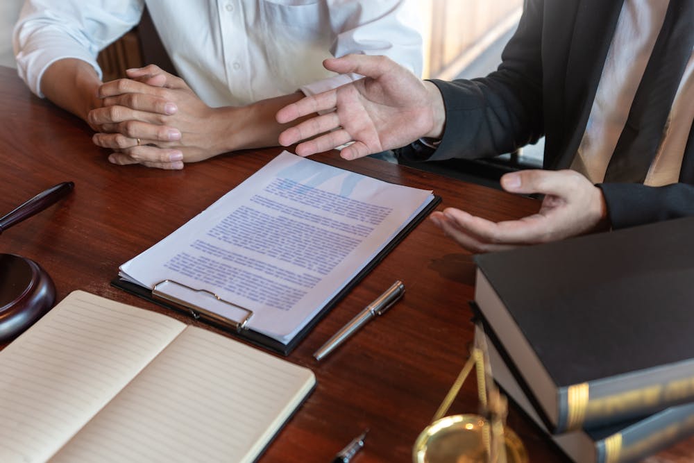 Lawyer discussing paperwork with a client