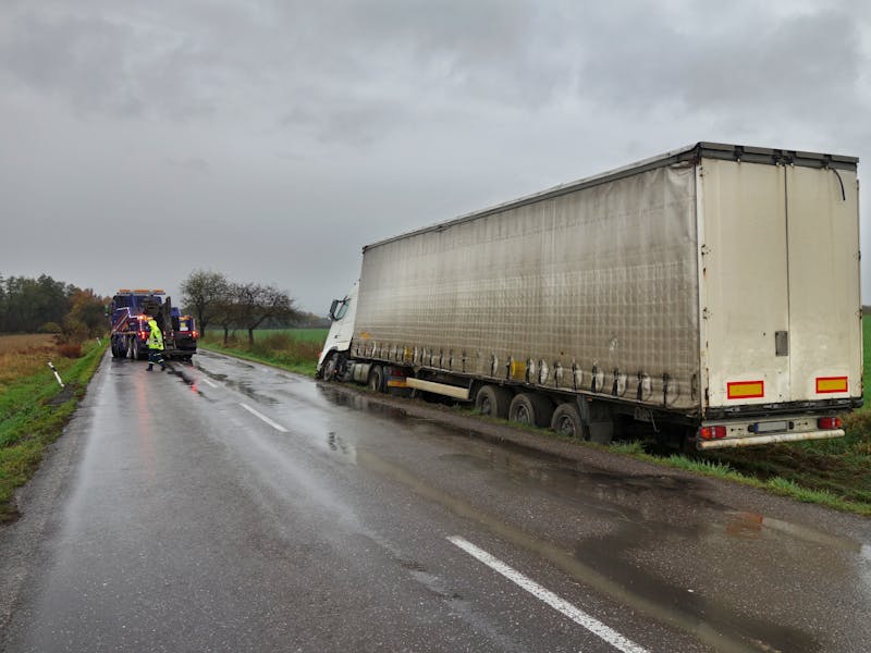 Semi truck stuck in a ditch