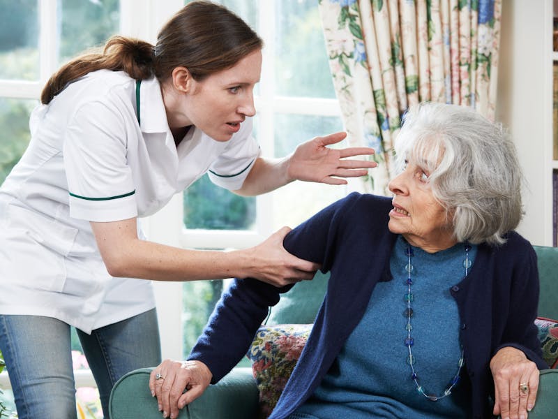 Nursing home working yelling at an elderly resident